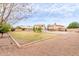 Expansive backyard featuring a swimming pool, a large grassy area, and a concrete slab for recreation at 7953 W Topeka Dr, Glendale, AZ 85308