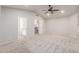 Bright and airy bedroom with en-suite bathroom, neutral carpet, ceiling fan and vaulted ceiling at 7953 W Topeka Dr, Glendale, AZ 85308