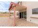 Cozy covered patio with brick pavers and an outdoor fridge, ideal for outdoor entertaining and relaxation at 7953 W Topeka Dr, Glendale, AZ 85308