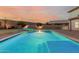 Inviting swimming pool with surrounding patio, perfect for outdoor entertaining and enjoying warm evenings at 7953 W Topeka Dr, Glendale, AZ 85308