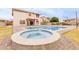 Backyard oasis featuring a swimming pool, spa, and an outdoor kitchen with an island bar for entertaining at 7953 W Topeka Dr, Glendale, AZ 85308