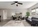 Spacious living room featuring hardwood floors, natural light, and a plush gray sofa set, creating a relaxing ambiance at 814 E 11Th Ave, Mesa, AZ 85204