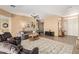 Bright living room with neutral decor, large area rug, and plenty of seating at 8176 E Sweet Bush Ln, Gold Canyon, AZ 85118