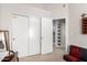 Bedroom featuring a closet, doorway, and view of another room at 10664 E Emerald Ave, Mesa, AZ 85208