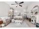 Bright living room with neutral tones, fireplace, vaulted ceilings, and cozy seating at 10664 E Emerald Ave, Mesa, AZ 85208