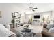 Bright living room with neutral tones, fireplace, and a cozy sectional sofa at 10664 E Emerald Ave, Mesa, AZ 85208