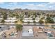 Expansive aerial view of a desert community showcasing single-Gathering homes and mountain views in the distance at 1101 E Cheryl Dr, Phoenix, AZ 85020