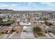 Wide aerial perspective of a residential neighborhood with diverse housing styles and a view of local amenities at 1101 E Cheryl Dr, Phoenix, AZ 85020