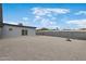 Gravel backyard featuring a privacy fence and sliding glass door to the house at 1101 E Cheryl Dr, Phoenix, AZ 85020