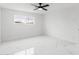 A well-lit bedroom featuring a ceiling fan and a window with a view at 1101 E Cheryl Dr, Phoenix, AZ 85020