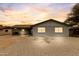 Charming single-story home with a neutral-colored exterior and low-maintenance desert landscaping in front at 1101 E Cheryl Dr, Phoenix, AZ 85020