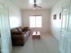 Comfortable living area featuring a brown sofa and neutral decor at 1185 N Sherwood Way, Queen Valley, AZ 85118