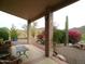 Covered patio with desert landscaping and views of the surrounding mountains at 1185 N Sherwood Way, Queen Valley, AZ 85118