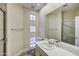 Bright bathroom featuring a vanity sink, walk-in shower, and window for natural light at 11919 E Del Timbre Dr, Scottsdale, AZ 85259