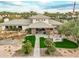 Aerial view of the community clubhouse and amenities, surrounded by lush landscaping and greenery at 11919 E Del Timbre Dr, Scottsdale, AZ 85259