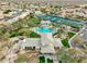 Overhead shot showing the pool, clubhouse, and tennis courts in the gated community at 11919 E Del Timbre Dr, Scottsdale, AZ 85259