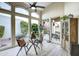 Cozy dining area near the window with comfortable chairs and views of the beautiful outdoor landscape at 11919 E Del Timbre Dr, Scottsdale, AZ 85259