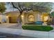 Charming single-story home featuring desert landscaping, a tiled roof, and a cozy front bench at 11919 E Del Timbre Dr, Scottsdale, AZ 85259