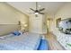 Spacious main bedroom with a light color palette, ceiling fan, and hardwood floors at 11919 E Del Timbre Dr, Scottsdale, AZ 85259