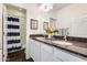 This bathroom features double sinks with granite countertops, white cabinets and an open view to the shower at 12246 W Paso Trl, Peoria, AZ 85383