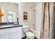 Bathroom with marble vanity, white cabinetry, a shower/tub combo and decorative accents at 12246 W Paso Trl, Peoria, AZ 85383