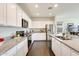 Bright kitchen featuring white cabinets, stainless steel appliances, and granite countertops at 12246 W Paso Trl, Peoria, AZ 85383