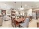 Open-concept space with dining area leading into the kitchen and living room, great for entertaining at 13102 S 177Th Dr, Goodyear, AZ 85338