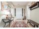 Spacious foyer featuring tile flooring, decor, and a rustic wooden bench and accents at 13102 S 177Th Dr, Goodyear, AZ 85338