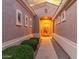 Inviting front entrance with manicured bushes and pathway to the door, with covered entryway at 13102 S 177Th Dr, Goodyear, AZ 85338