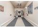 Organized garage with custom ceiling racks, storage for bikes, and a clean, finished floor at 13102 S 177Th Dr, Goodyear, AZ 85338