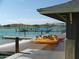 Waterfront view of a lake with a pedal boat docked near a covered structure at 13102 S 177Th Dr, Goodyear, AZ 85338