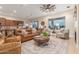 Inviting living room with tile floors, ceiling fan, and comfortable seating next to the kitchen at 13102 S 177Th Dr, Goodyear, AZ 85338