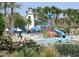 Fun waterpark area with slides, a lighthouse and a Gathering friendly atmosphere at 13102 S 177Th Dr, Goodyear, AZ 85338