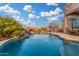 Lush backyard pool with a rock waterfall feature at 13102 S 177Th Dr, Goodyear, AZ 85338