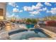 Backyard features a sparkling pool, hot tub, and outdoor seating at 13102 S 177Th Dr, Goodyear, AZ 85338