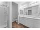 Bathroom featuring double vanity sinks and a walk-in shower at 13341 W Yearling Rd, Peoria, AZ 85383