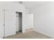 Bedroom with light carpet and a closet with paneled doors at 15397 W Hackamore Dr, Surprise, AZ 85387