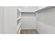 An empty walk-in closet with carpet and shelving at 15397 W Hackamore Dr, Surprise, AZ 85387