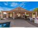 Expansive covered patio overlooking the pool, perfect for outdoor dining and relaxation at 15788 W Sierra St, Surprise, AZ 85379