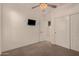 Bedroom with neutral walls and carpet and large closet at 15788 W Sierra St, Surprise, AZ 85379