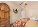 Bright bedroom with a large armoire and decor above the bed at 15788 W Sierra St, Surprise, AZ 85379