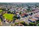 Aerial view of a residential neighborhood with well-maintained homes and green spaces at 16161 W Monte Cristo Ave, Surprise, AZ 85374