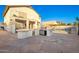 Outdoor kitchen and patio area with built-in grill, bar, and sink, perfect for outdoor dining at 16161 W Monte Cristo Ave, Surprise, AZ 85374