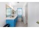 Bright bathroom featuring a double sink vanity, a bathtub, and lots of natural light at 16161 W Monte Cristo Ave, Surprise, AZ 85374