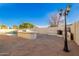 Spacious backyard with an outdoor kitchen and cozy fireplace at 16161 W Monte Cristo Ave, Surprise, AZ 85374