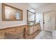 Bathroom featuring dual vessel sinks, ornate mirrors, and decorative vanity at 16734 E La Montana Dr # 103, Fountain Hills, AZ 85268