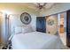 Bedroom with ornamental wall decor, ceiling fan, and an open door at 16734 E La Montana Dr # 103, Fountain Hills, AZ 85268