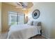 Cozy bedroom featuring a ceiling fan and a sunlit window at 16734 E La Montana Dr # 103, Fountain Hills, AZ 85268