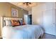 Bedroom featuring a ceiling fan, upholstered headboard, and closet at 16734 E La Montana Dr # 103, Fountain Hills, AZ 85268