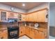 Well-lit kitchen featuring granite counters, stainless steel appliances, and custom cabinetry at 16734 E La Montana Dr # 103, Fountain Hills, AZ 85268